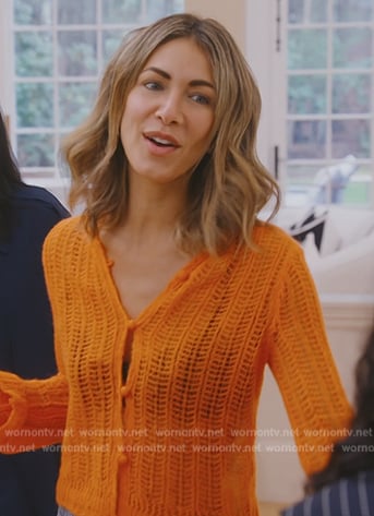 Erin’s orange crochet knit cardigan on The Real Housewives of New York City
