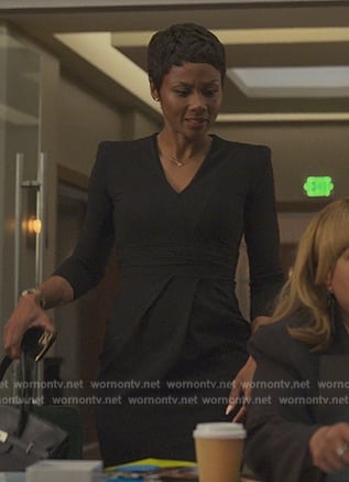 Jax’s black padded shoulder dress on Reasonable Doubt