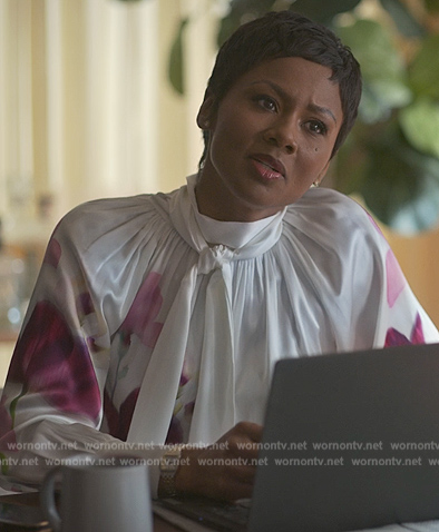 Jax’s white floral print turtleneck blouse on Reasonable Doubt