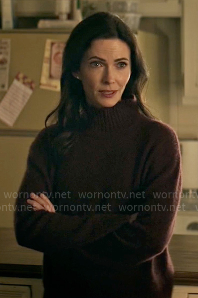 Lois’s burgundy mock-neck sweater on Superman and Lois
