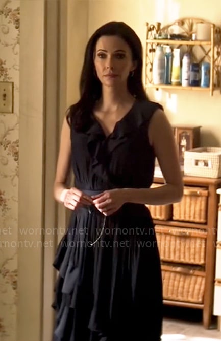 Lois’s navy dress with ruffles on Superman and Lois
