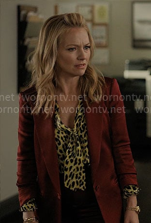 Lorna’s yellow leopard blouse and red satin suit on The Lincoln Lawyer