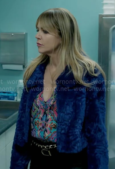 Morgan’s colorful printed blouse and blue fur jacket on High Potential