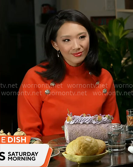 Nancy Chen’s red sweater with gold buttons on CBS Mornings