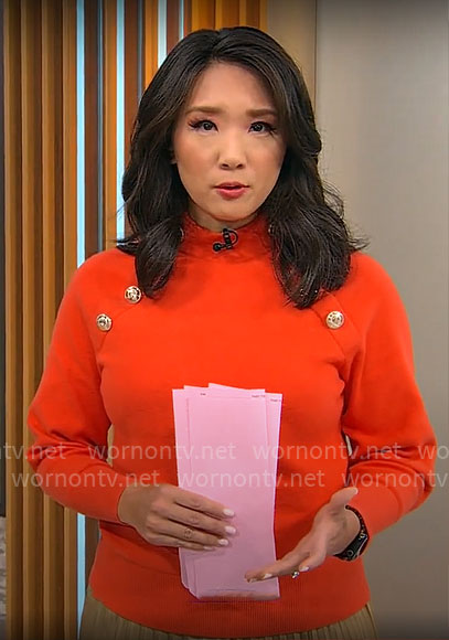 Nancy Chen’s red sweater with gold buttons on CBS Mornings