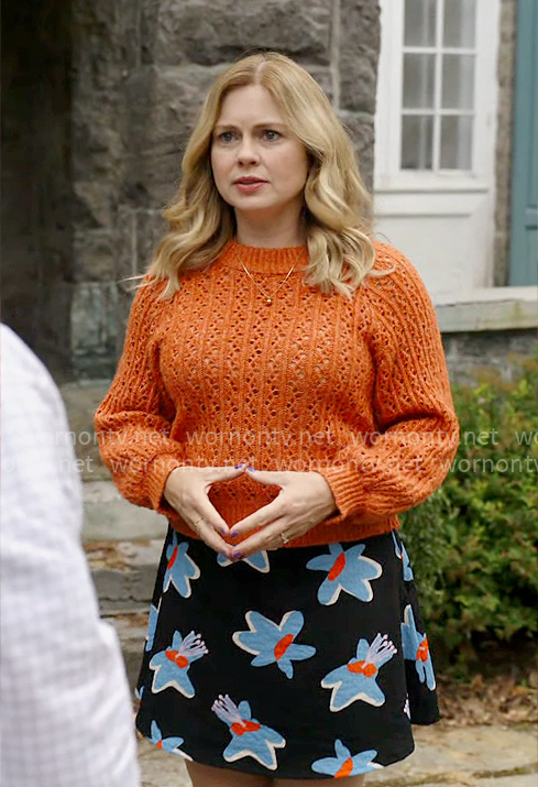 Sam’s floral skirt and orange sweater on Ghosts