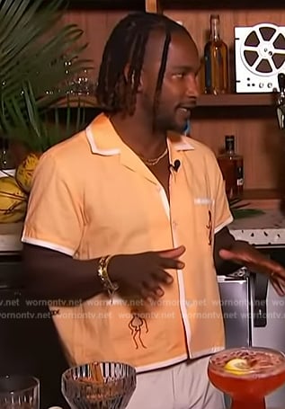 Scott’s orange contrast trim shirt on Access Hollywood