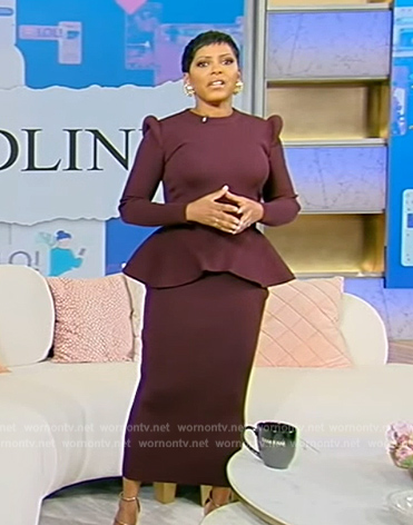 Tamron’s burgundy peplum sweater and skirt on Tamron Hall Show