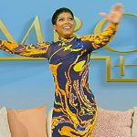 Tamron’s black sheer embellished dress on Tamron Hall Show