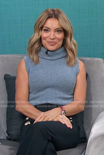 Kit’s blue sweater vest on Access Hollywood