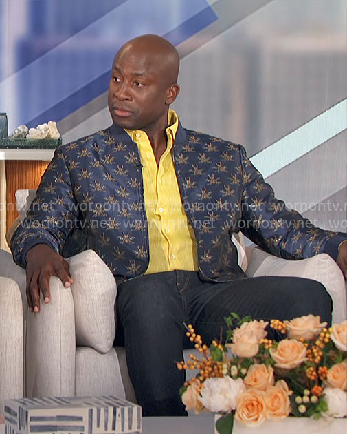 Akbar’s blue bee print bomber jacket and spiked sneakers on The Talk