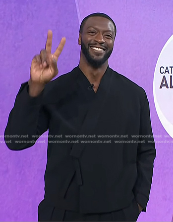 Aldis Hodge’s black wrap shirt and pants on Today