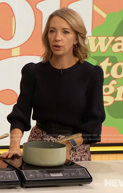 Anna Robertson’s black ribbed puff sleeve sweater and skirt on The Drew Barrymore Show