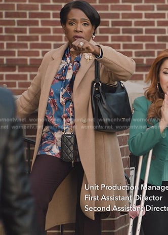 Barbara’s blue floral print tie neck blouse on Abbott Elementary