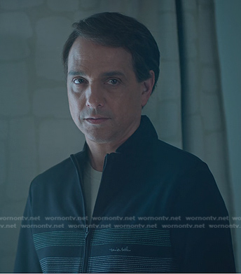 Daniel’s black stripe half-zip sweatshirt on Cobra Kai