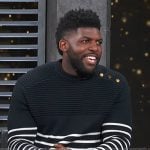 Emmanuel Acho’s navy stripe sweater on Access Hollywood