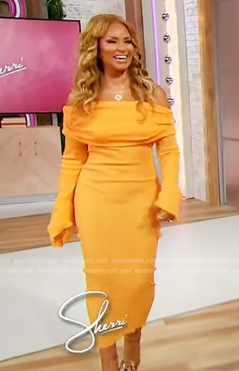 Gizelle Bryant’s orange off shoulder dress on Sherri