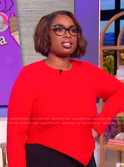 Jennifer’s red asymmetric sweater on The Jennifer Hudson Show