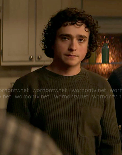 Jordan’s green sweater with patches on Superman and Lois