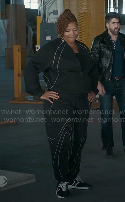 Robyn’s black tracksuit with white piping on The Equalizer