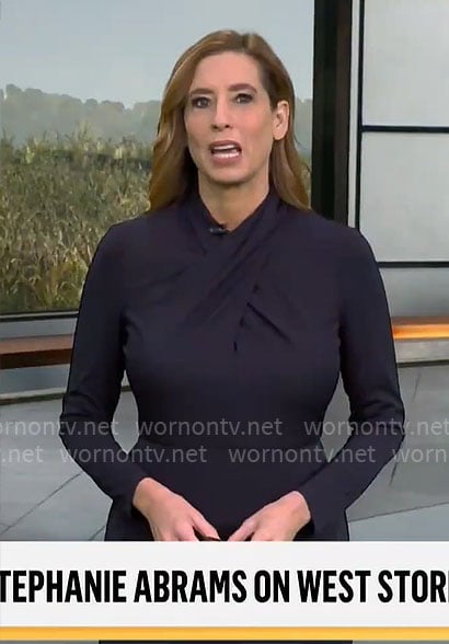 Stephanie Abrams’ navy cross-neck dress on CBS Mornings