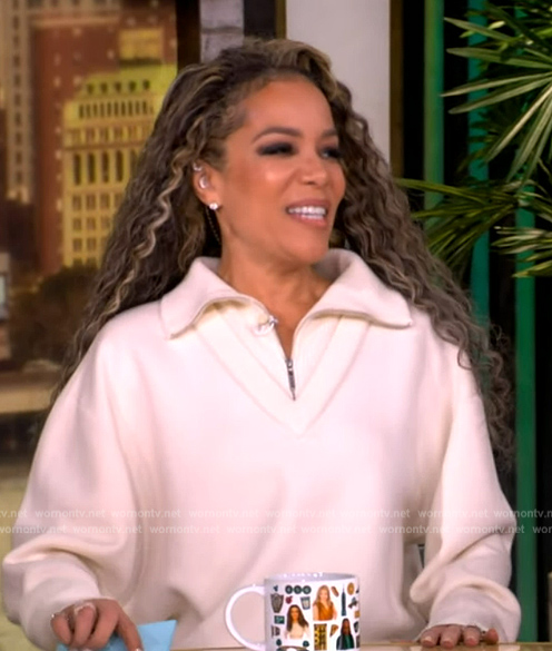 Sunny’s white zip sweater and skirt on The View