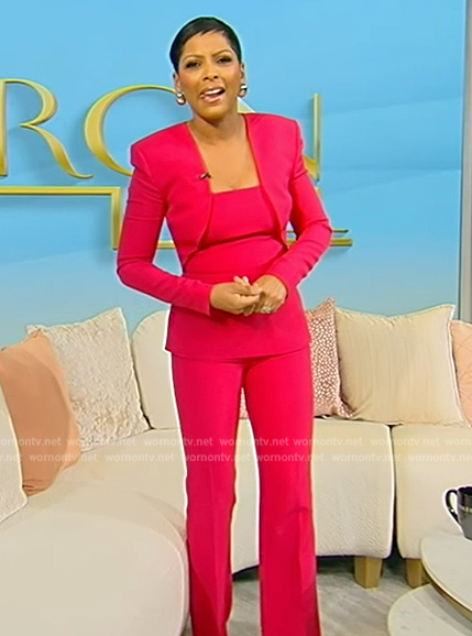 Tamron’s pink peplum blouse and pants on Tamron Hall Show