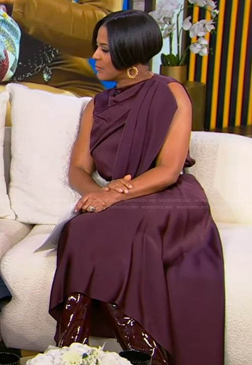 Tamron’s burgundy drape satin top and skirt on Tamron Hall Show