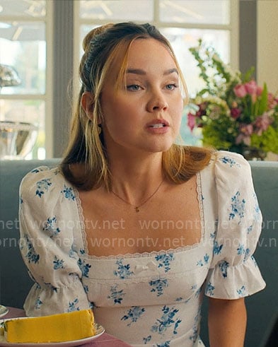 Tory’s white and blue floral dress on Based on a True Story