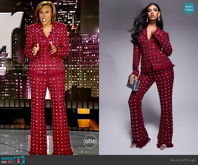 Asos Luxe Embellished Boucle Kick Flare Pants with Faux Feather Hem in Burgundy worn by Robin Roberts on Good Morning America