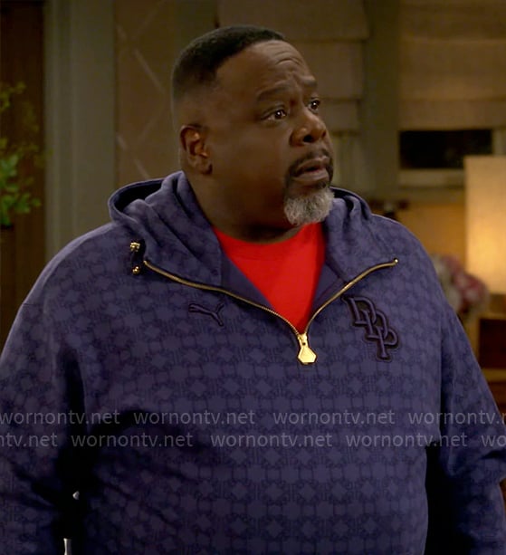 Calvin’s blue printed quarter zip hoodie on The Neighborhood