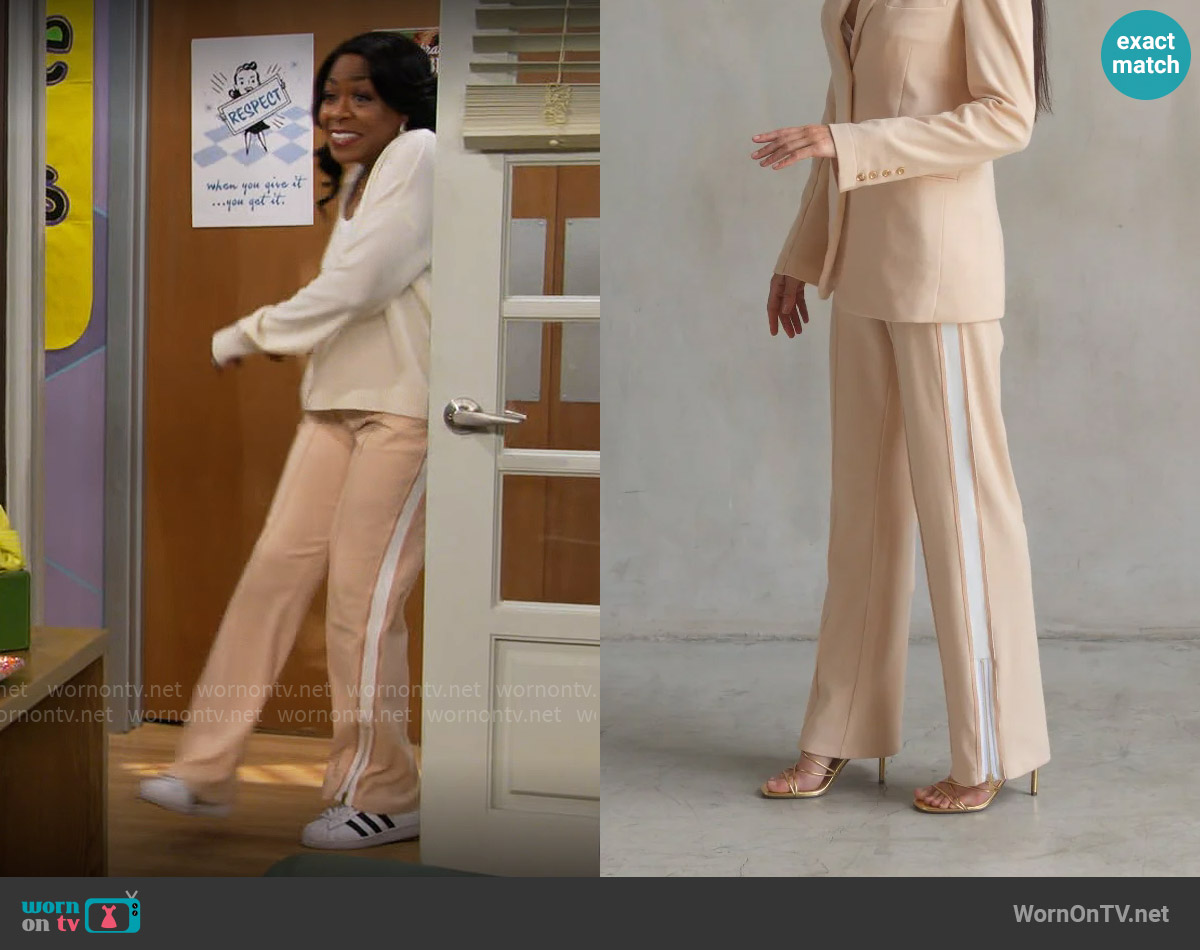 Care Tucker Jordan Interlock Pants in Crème worn by Tina Butler (Tichina Arnold) on The Neighborhood