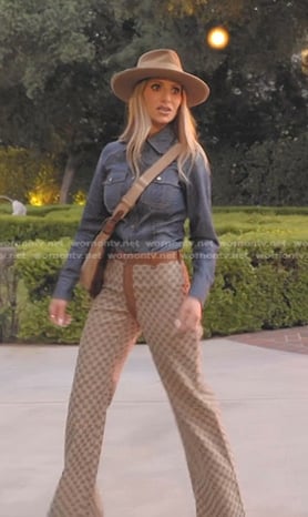 Dorit’s denim shirt and brown monogram pants on The Real Housewives of Beverly Hills