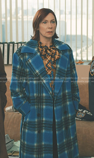 Elsbeth’s plaid tie neck blouse and blue plaid coat on Elsbeth