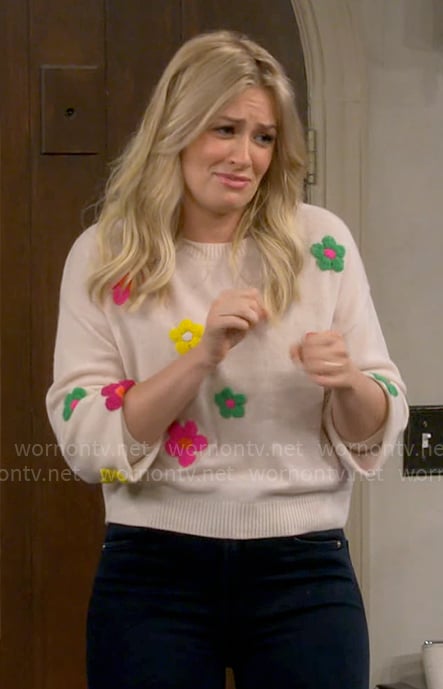 Gemma’s colorful floral sweater on The Neighborhood