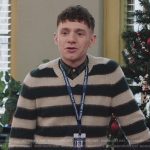 Jacob’s striped v-neck sweater on Abbott Elementary