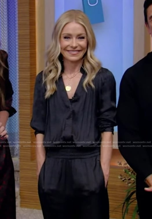 Kelly’s black satin jumpsuit and yellow pumps on Live with Kelly and Mark