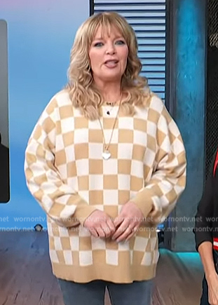 Melissa Peterman’s check print sweater on Access Hollywood
