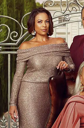 Nicole’s metallic off-shoulder sweater and skirt set on Beyond the Gates