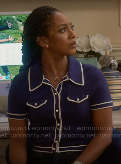 Nina’s blue cardigan with white trims on Poppas House