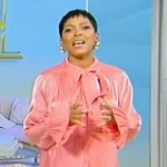 Tamron’s pink satin tie neck mini dress on Tamron Hall Show