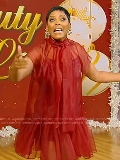 Tamron’s red sheer tie neck dress on Tamron Hall Show