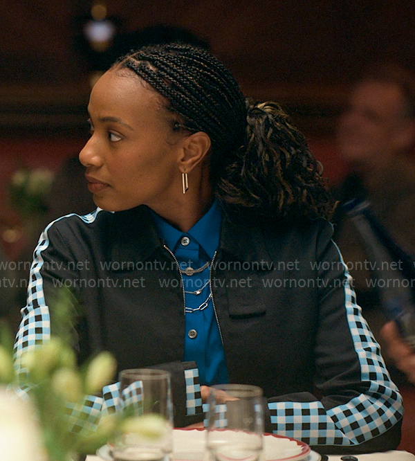 Whitney’s black jacket with checked sleeves on The Sex Lives of College Girls