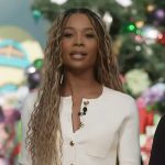 Zuri’s white button front cardigan on Access Hollywood