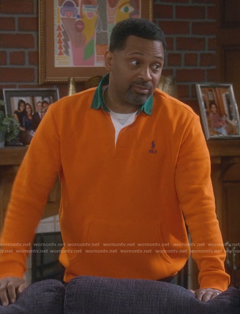 Bennie’s orange contrast polo sweater on The Upshaws