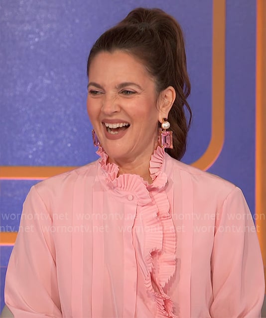 Drew Barrymore’s pink pleated ruffle blouse on Hollywood Squares