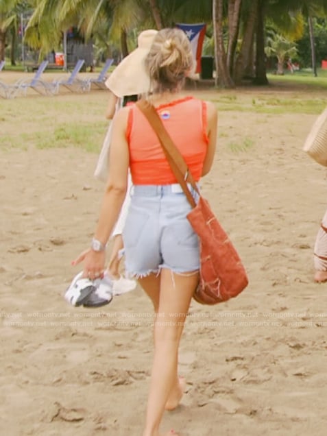 Erin’s orange ruffle trim top on The Real Housewives of New York City