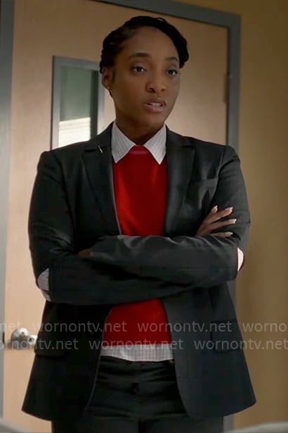 Faith’s pink grid shirt and red short-sleeve sweater on Will Trent