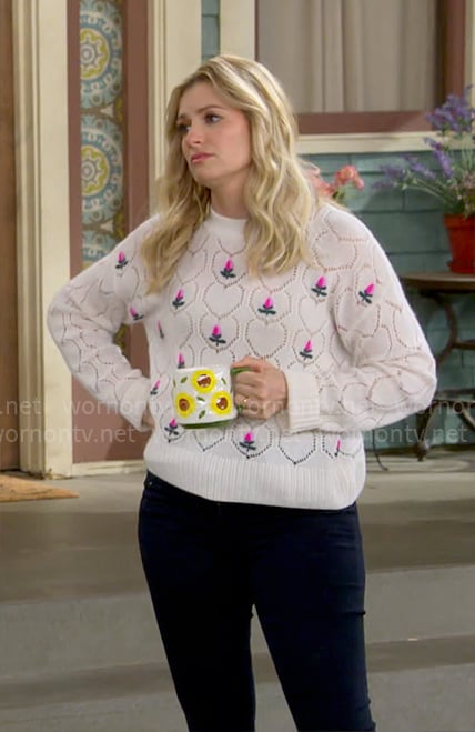 Gemma’s white floral embroidered sweater on The Neighborhood
