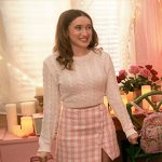 Kacey’s white cropped sweater and pink checked mini skirt on The Sex Lives of College Girls